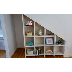 Full wall custom bookshelves, with adjustable shelving on the whole unit.