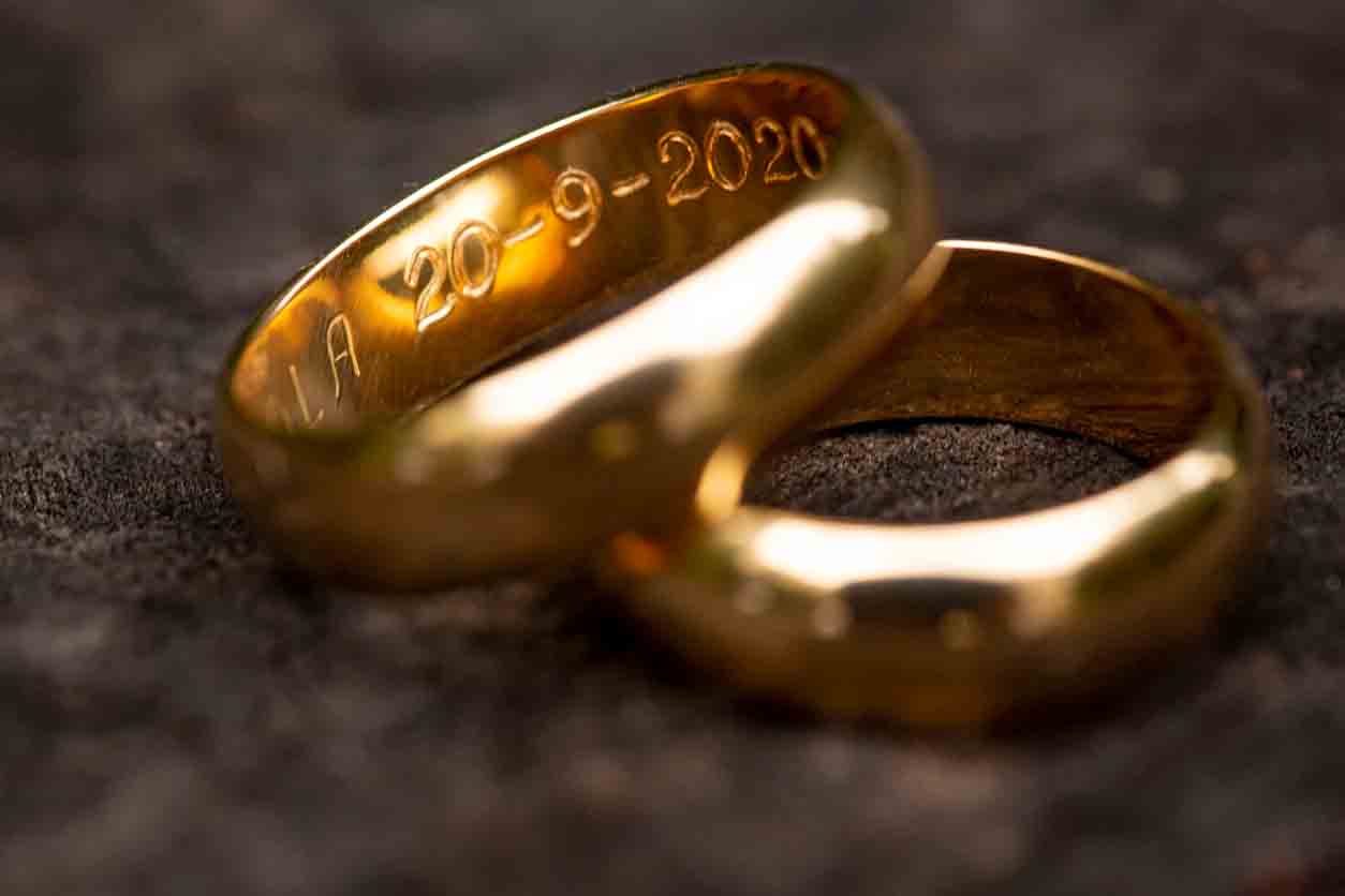 Two gold rings, stacked on top of each other with engraved numbers