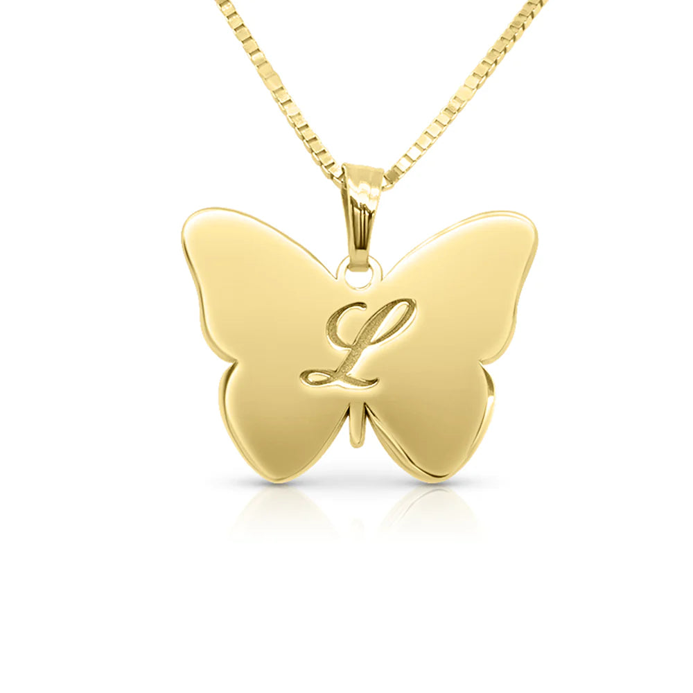 Gold butterfly engraved pendant on white background