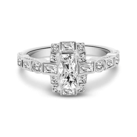 Silver ring with a centerpiece of rectangular diamond surrounded by smaller baguette and round cut diamonds on a white background 