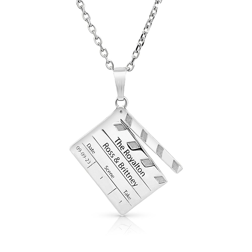 Silver director clap pendant on a white background