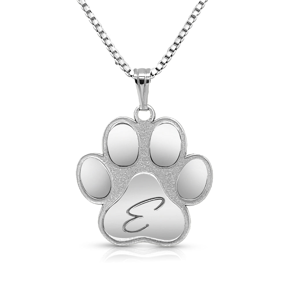 Silver paw print pendant on a white background