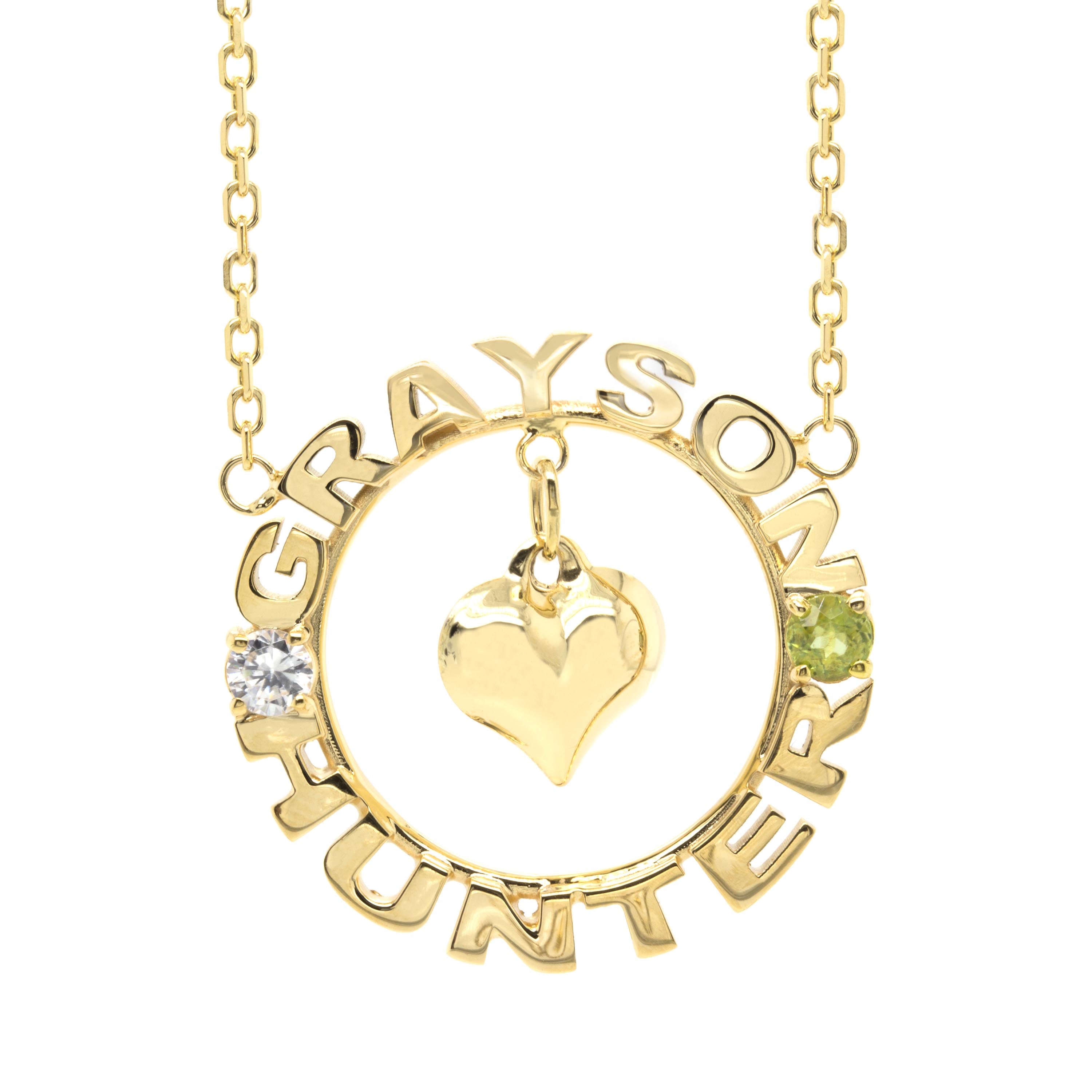 Gold circular pendant with a custom letter and heart shape on a white background
