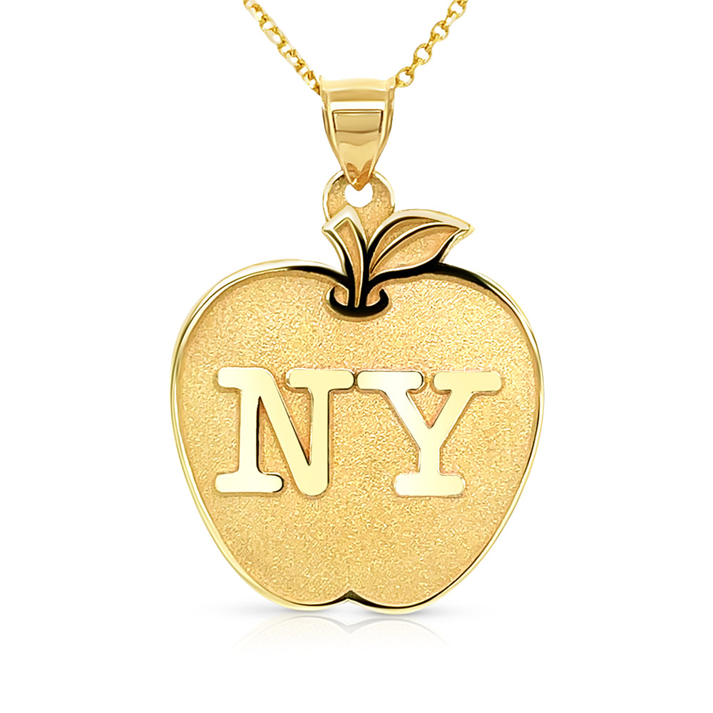 Gold apple pendant with an engraved letter on a white background