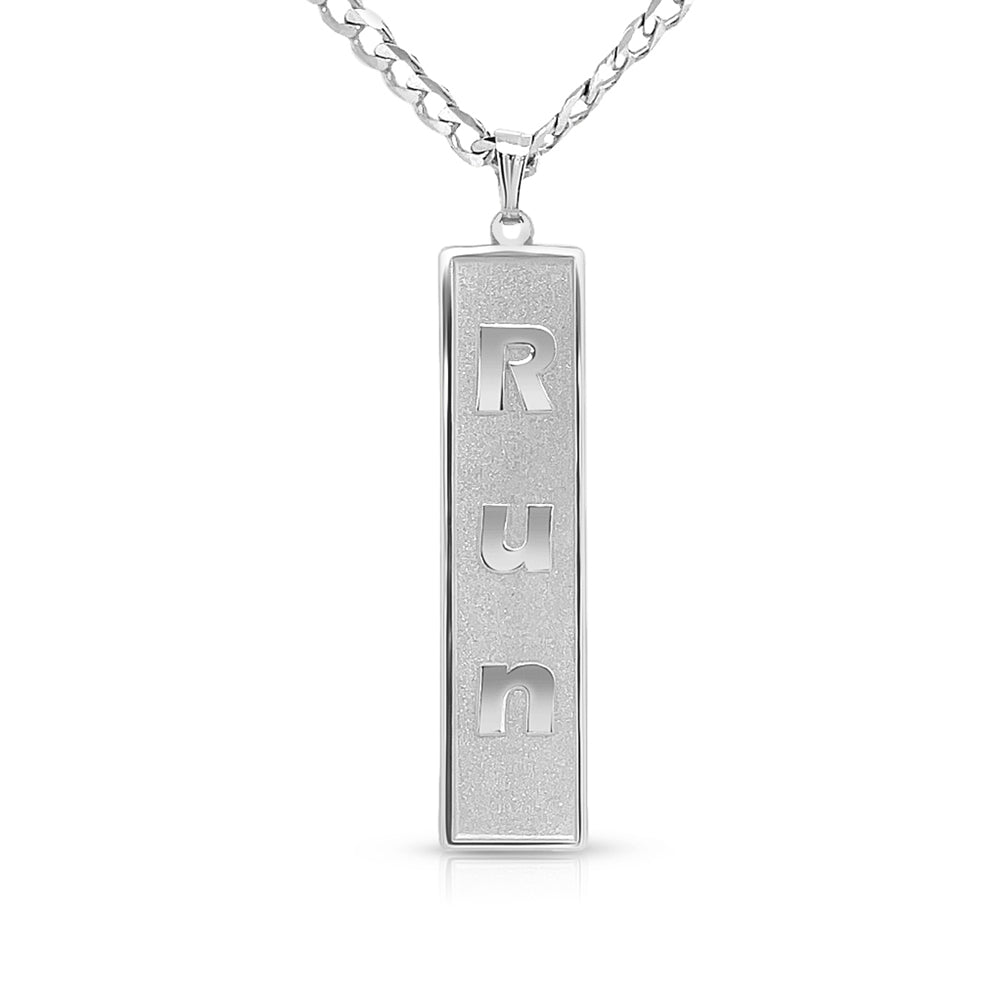 Silver rectangular pendant with an engraved name on a white background