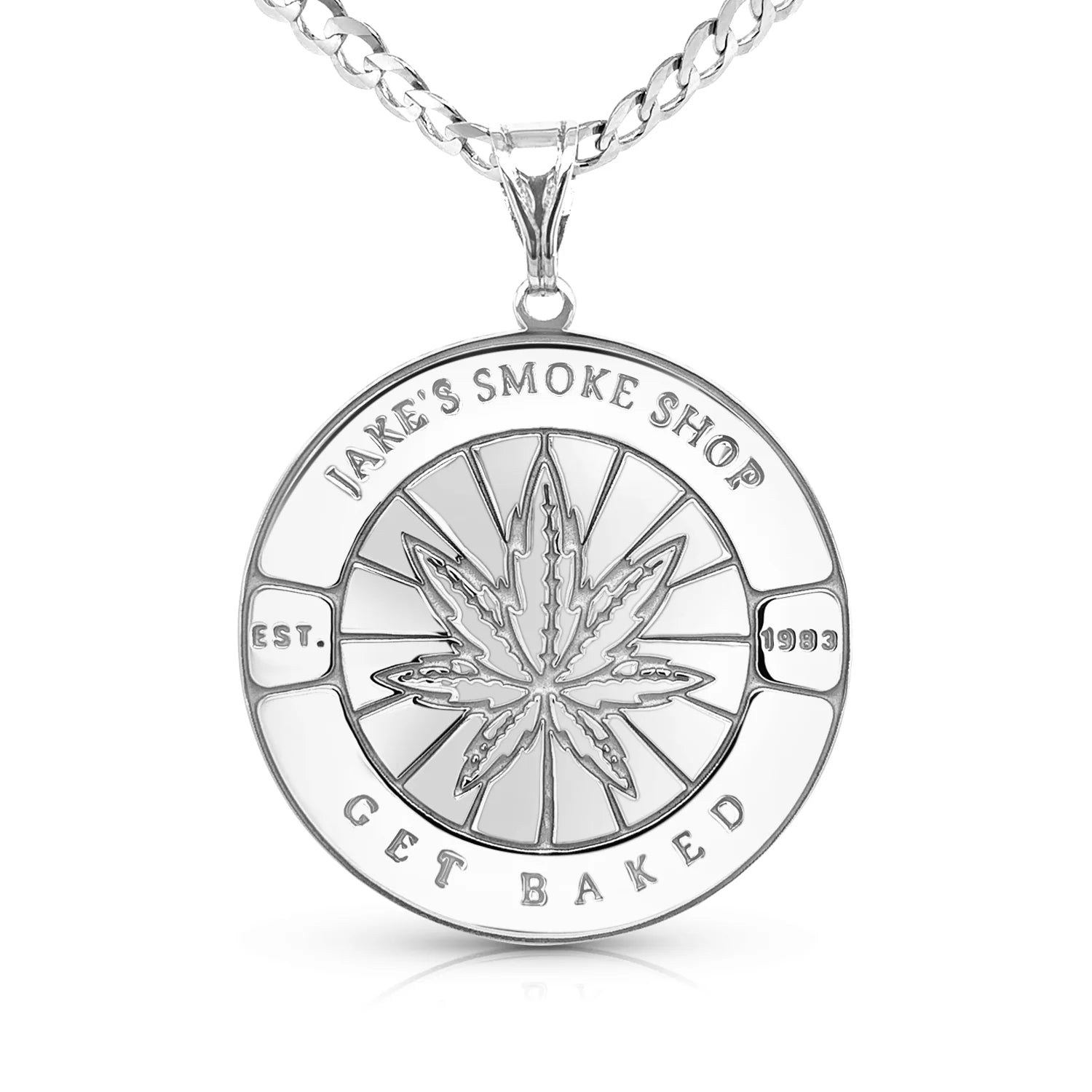 Silver pendant of a smoke shops brand on a white background