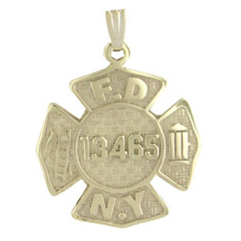 Gold shield pendant with engraved name on a white background