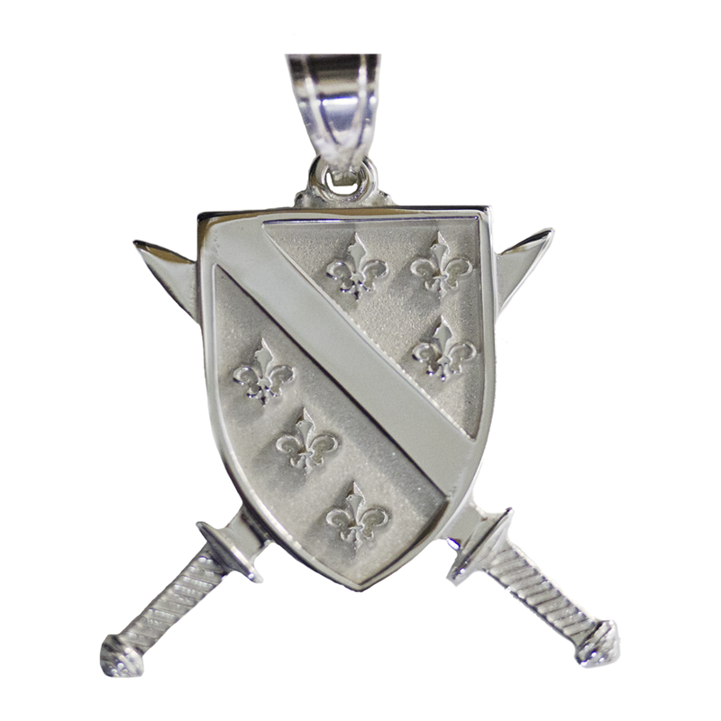 Silver shield pendant with cross sword design on a white background