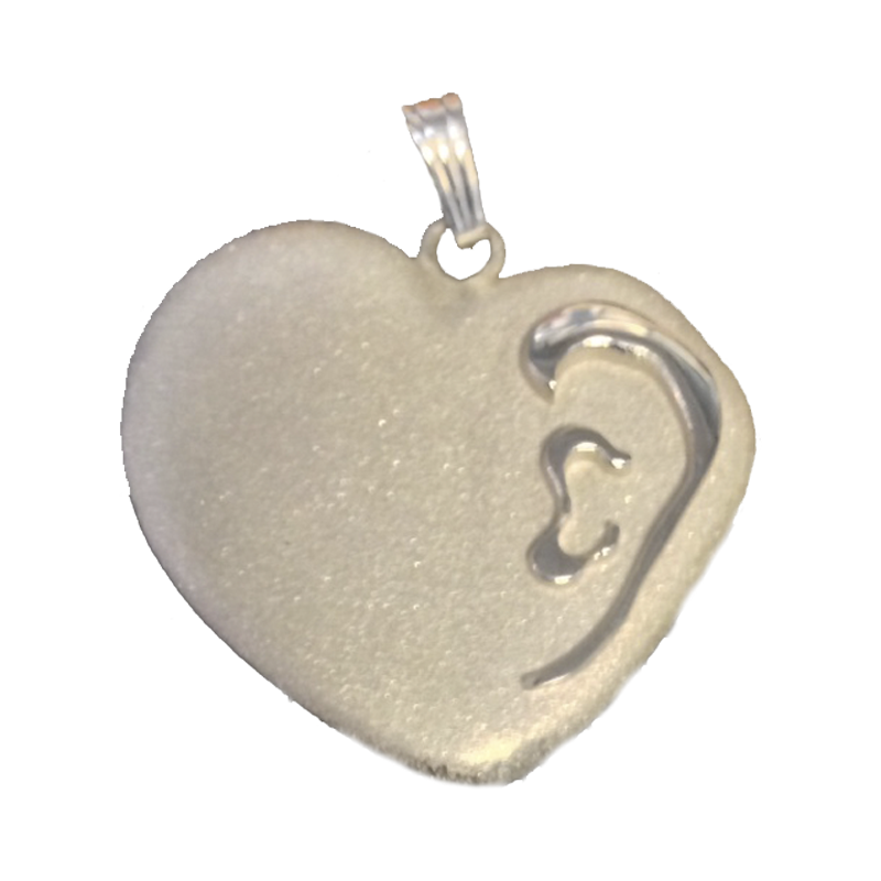 Silver heart shaped pendant with engraved design on a white background