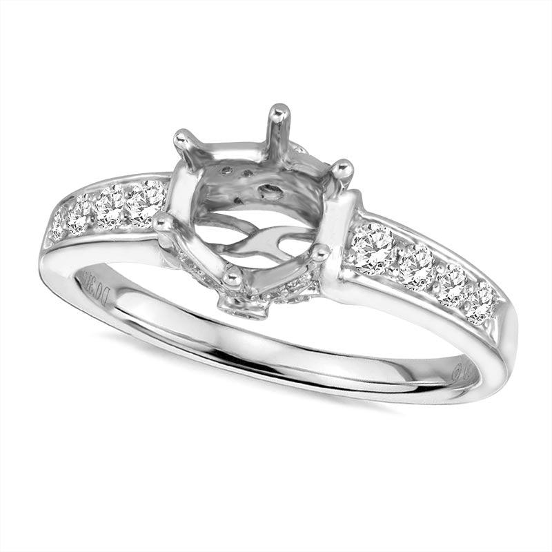 Silver diamond ring with a prong setting on a white background