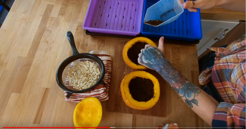 4 - Mandi of On The Grow adding Burpee Soil to inside of hallow pumpkin.PNG