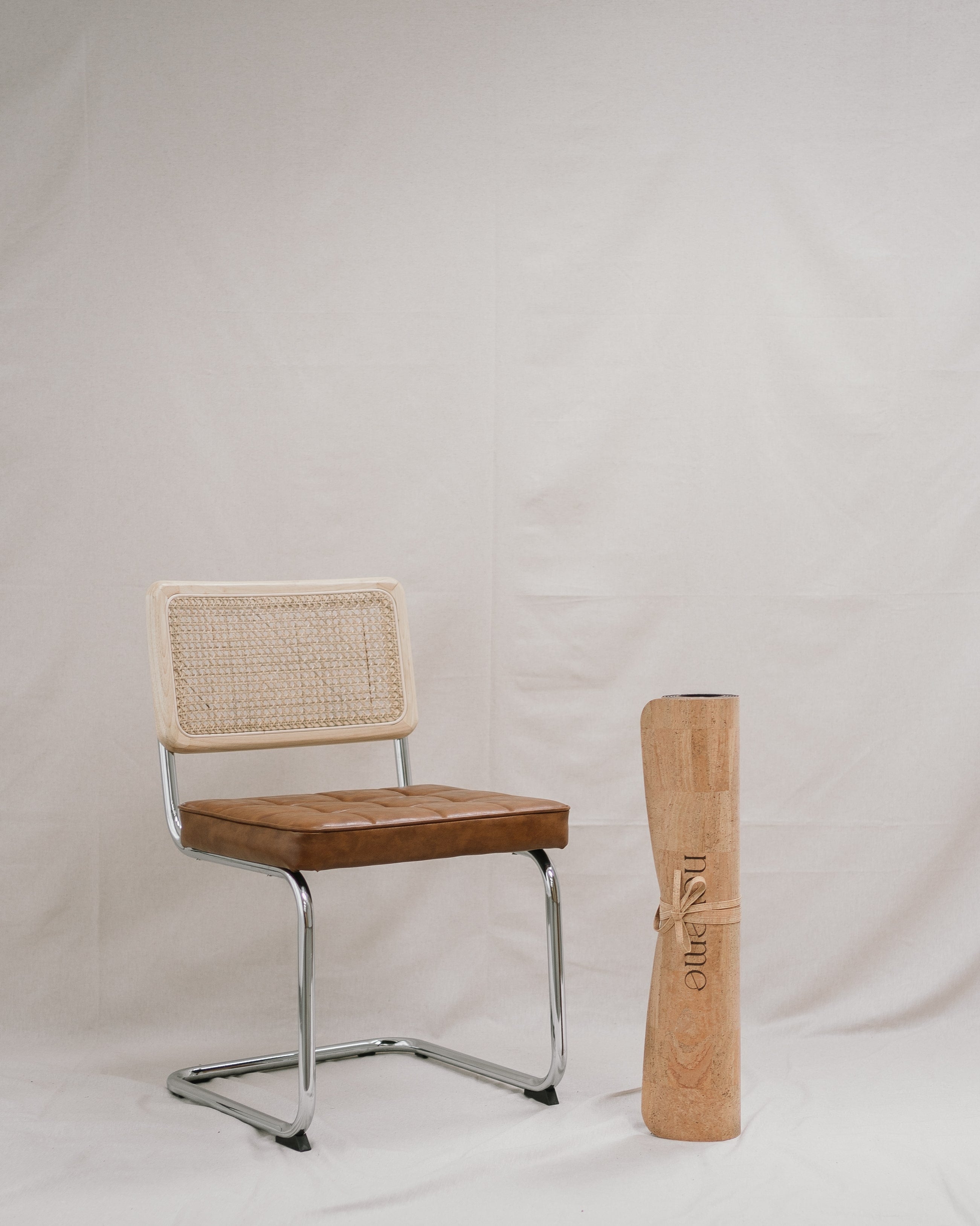 noveme cork yoga mat next to a chair