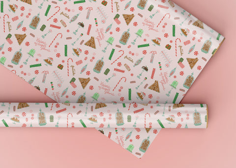 A wrapping paper roll featuring a soft pink background with a collection of Christmas Sweets and Treats.  Retro and Nostalgic.