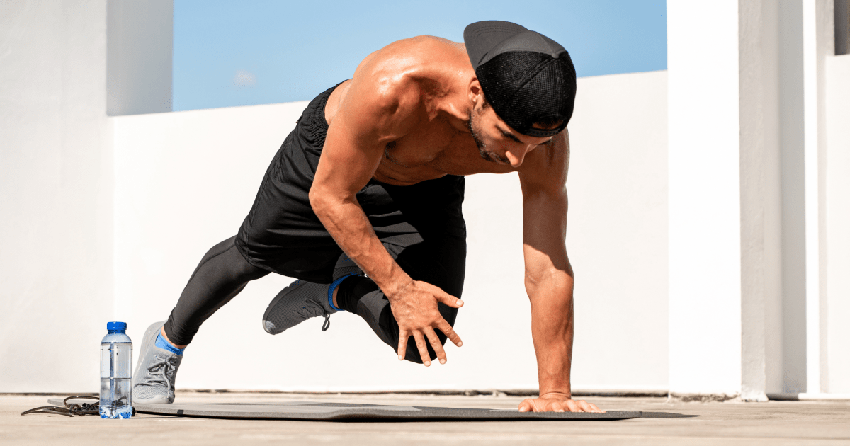 A man performing mountain climber exercise | Ultimate Nutrition