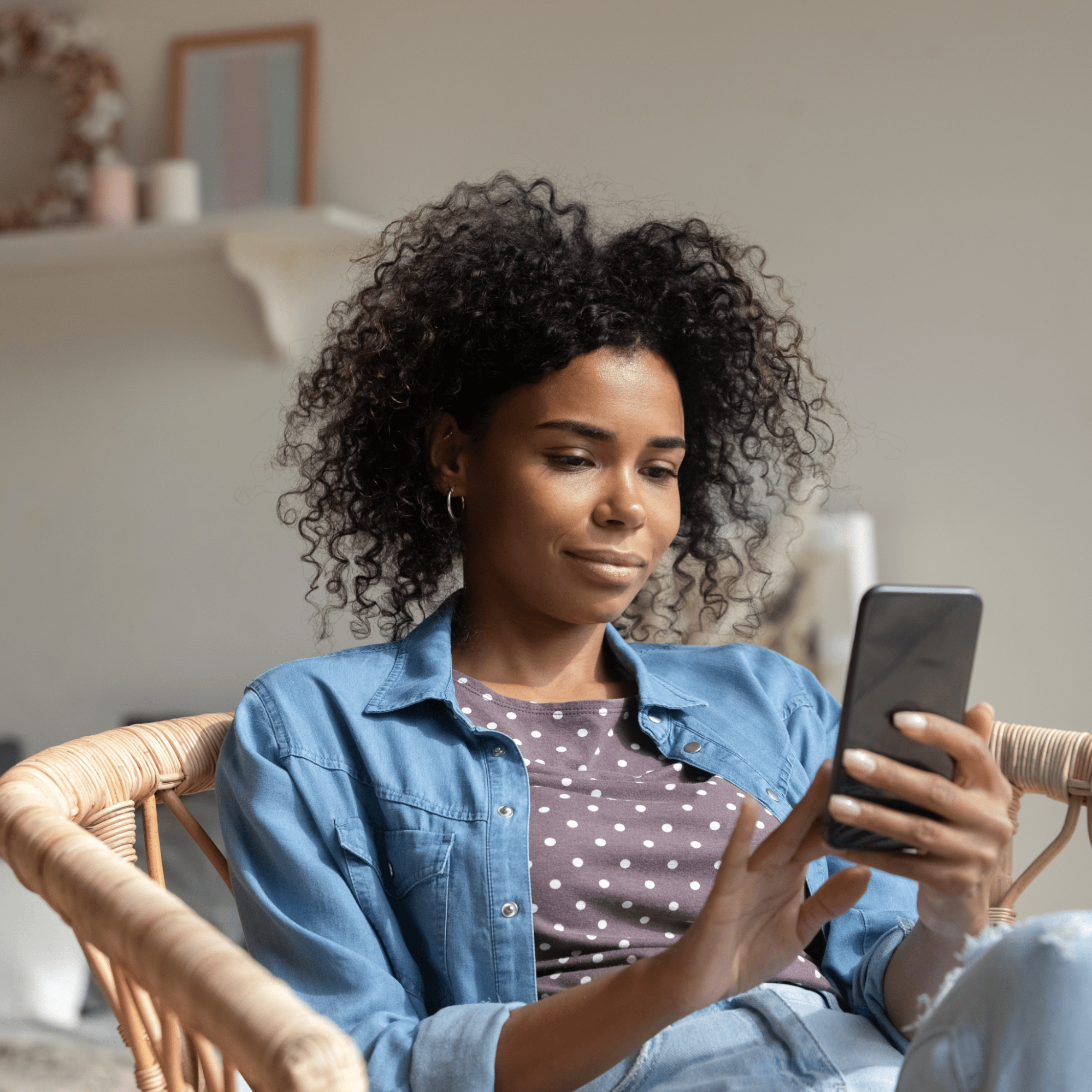 A woman scrolling on a cellphone | Ultimate Nutrition