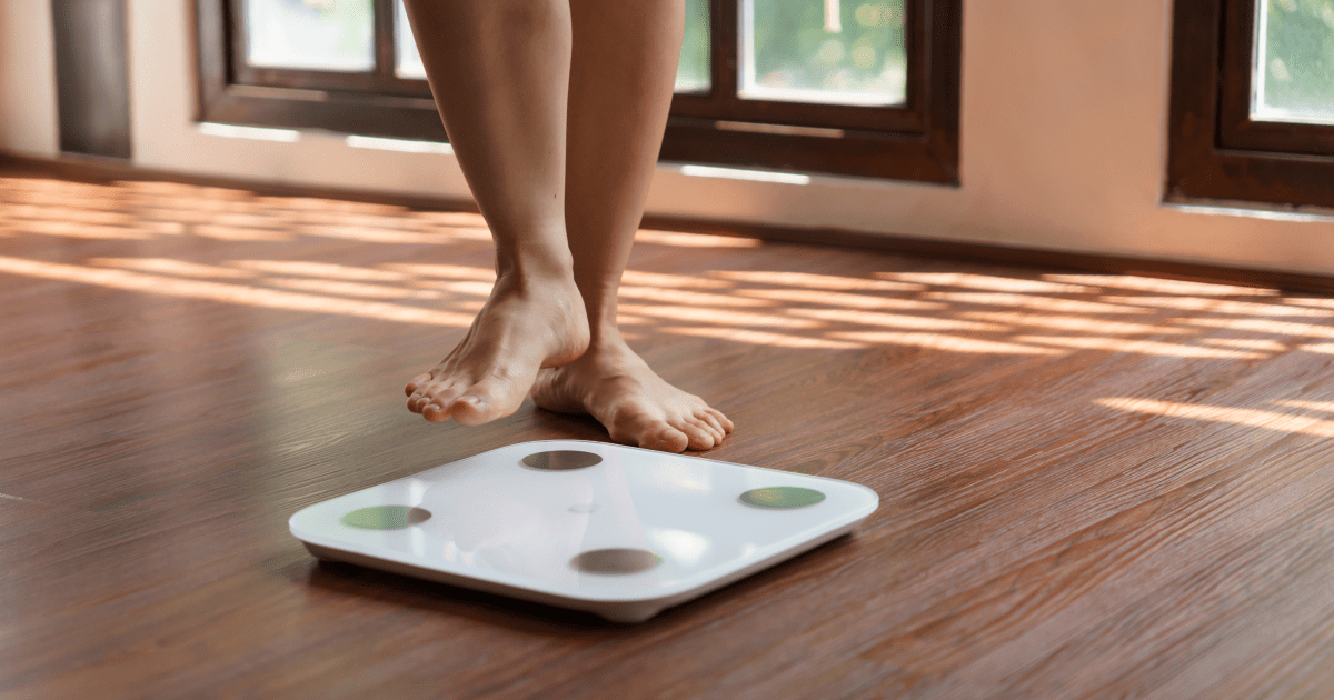 Stepping on a scale | Ultimate Nutrition