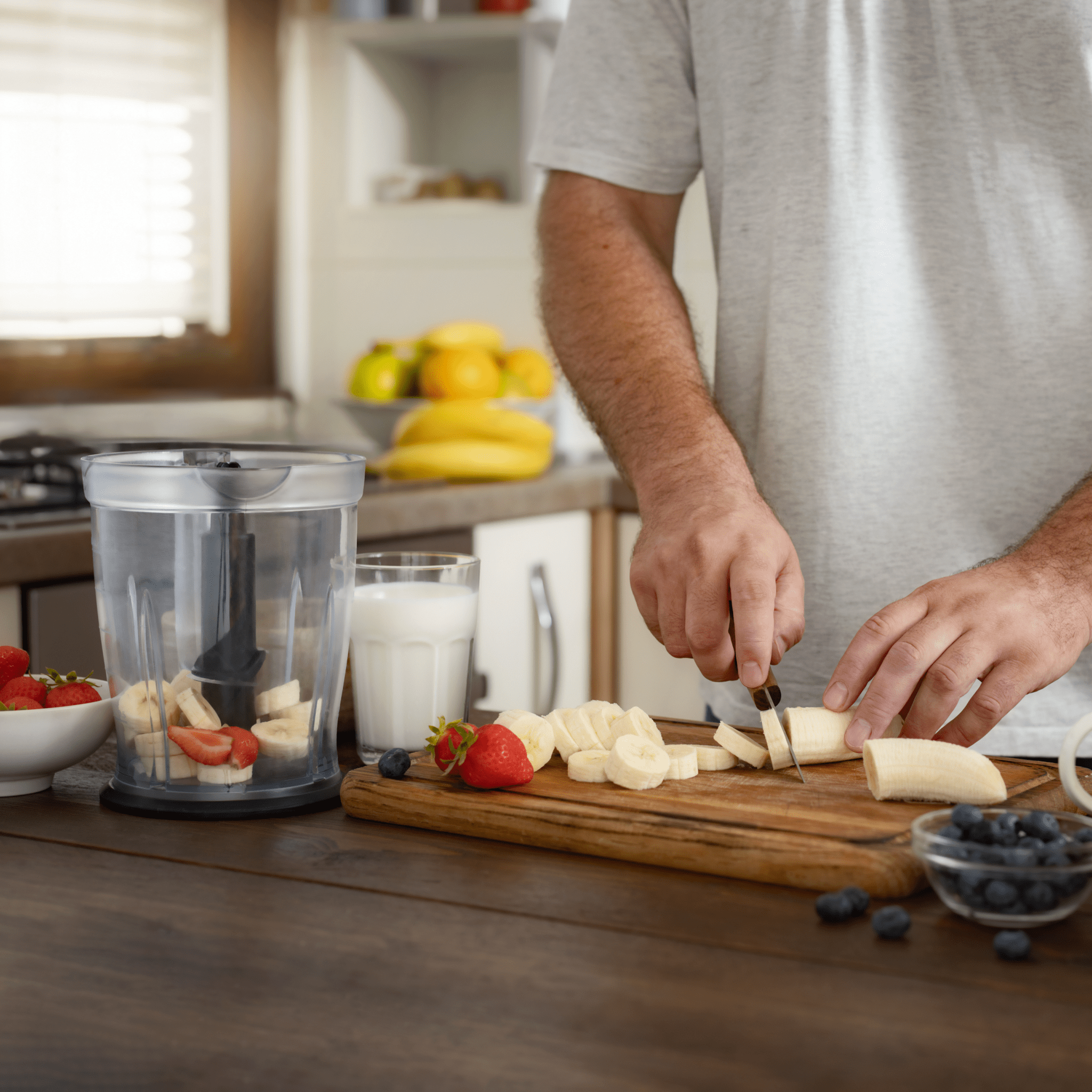 A man cutting fruit | Ultimate Nutrition