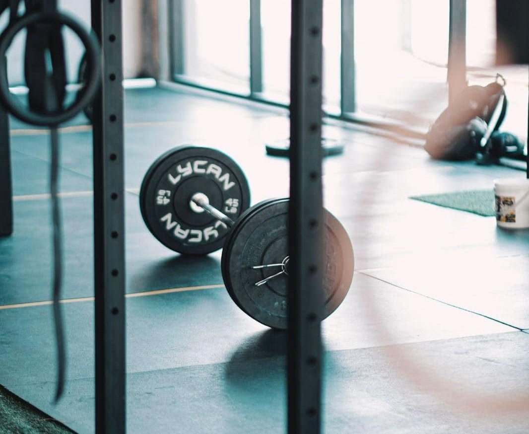 Loaded barbell on gym floor