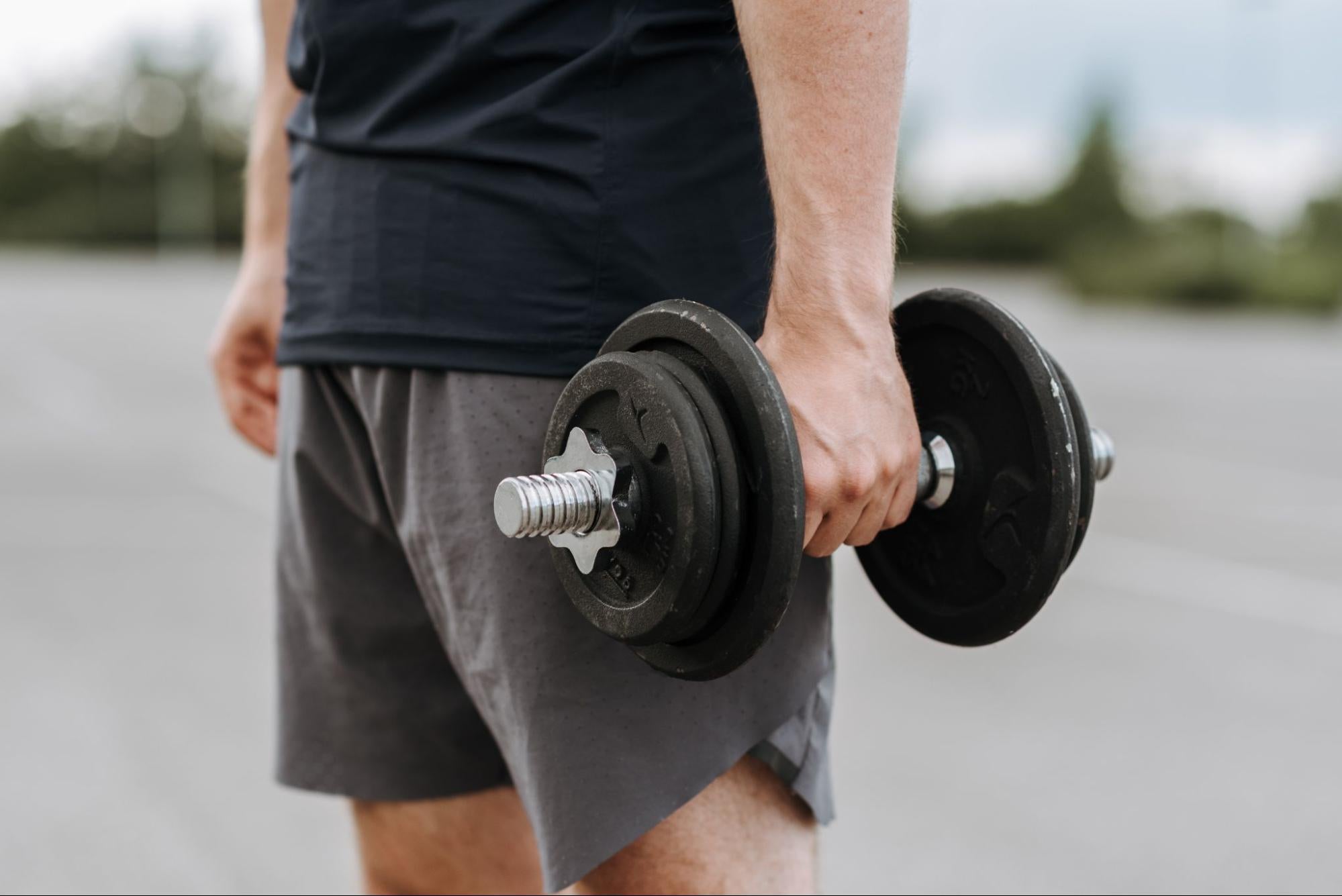 Man lifts dumbbell