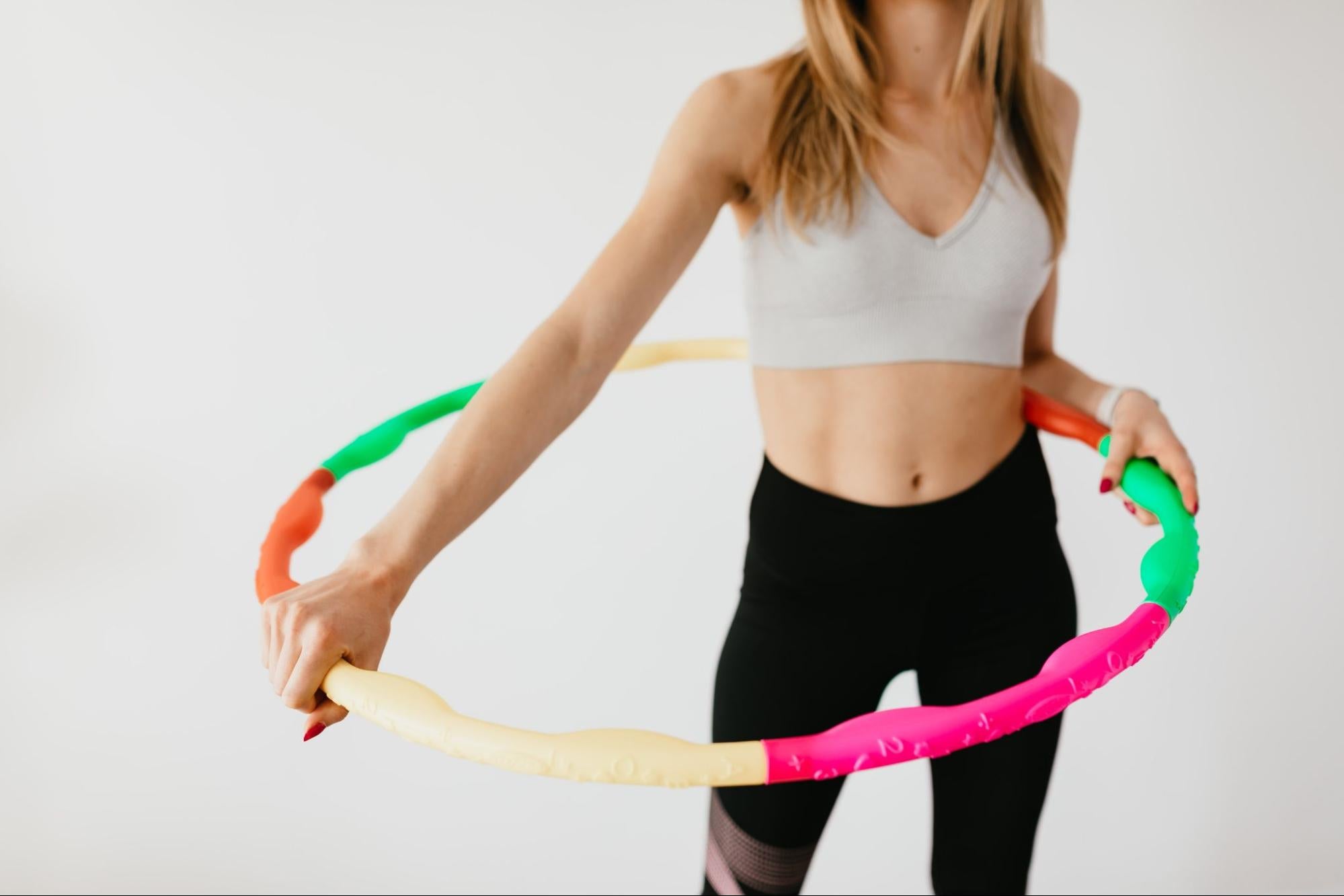 Woman exercising with hula hoop