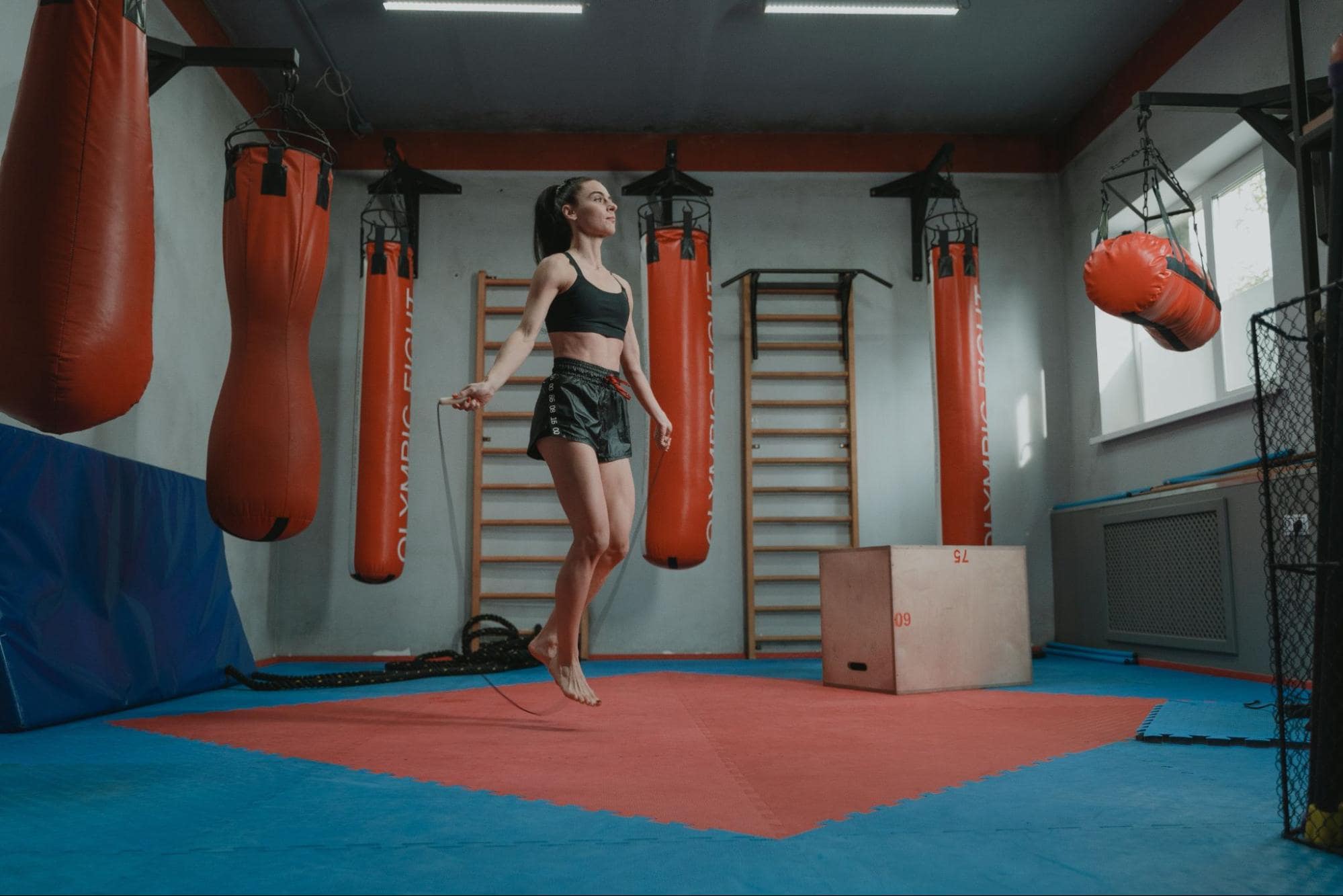 Person jump roping in a boxing ring