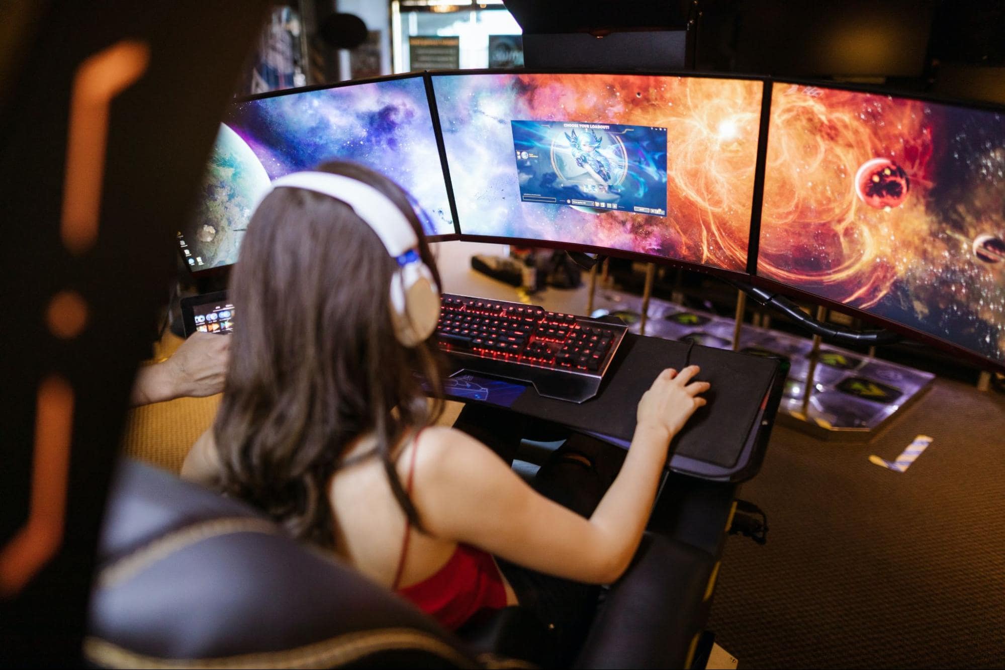 Person playing in gamer setup