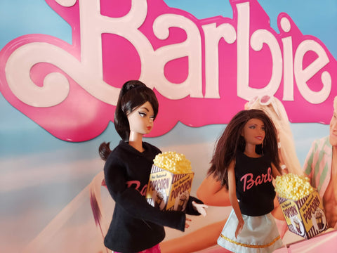 barbie in front of the sign