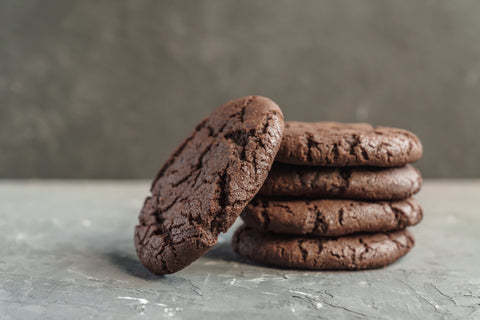 Double chocolate cookies stacked with sea salt
