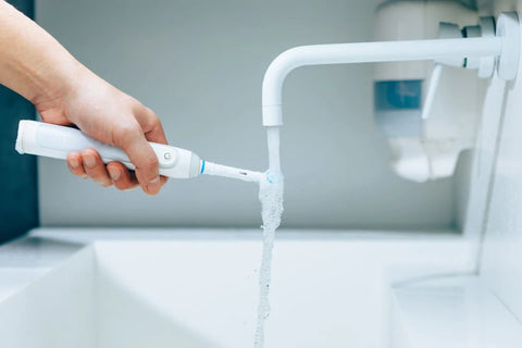 how to clean an electric toothbrush