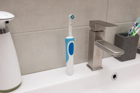 how to clean an electric toothbrush