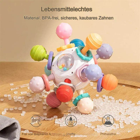 Rotierender Rasselball - sicheres Spielzeug