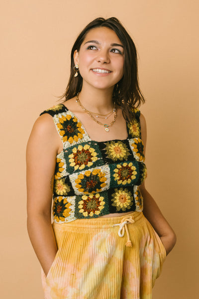 Lucy Beizer of Luce Threads wearing her own designs (crochet tank top, plant dye shorts) and a RIVA New York necklace