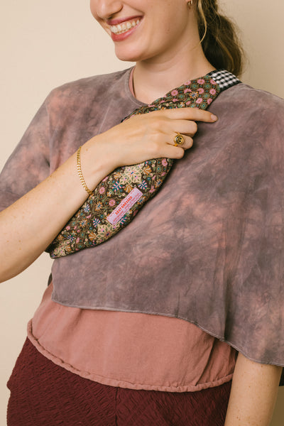 Zest Dressed's fanny pack made from vintage scarves; also in this photo is RIVA New York's curb chain bracelet in gold vermeil