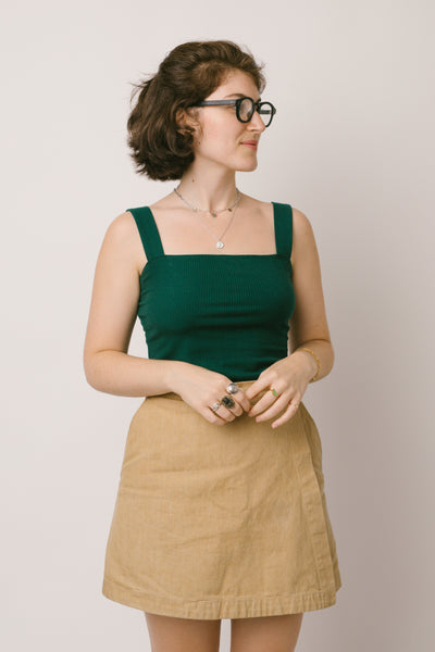 Sustainable Sabs in a Japanese denim skort from Ilana Kohn and RIVA New York jewelry