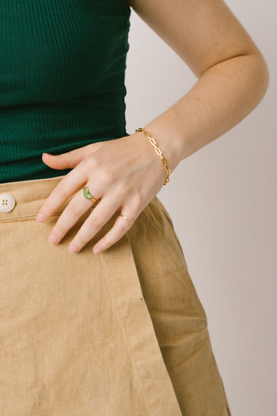 Sustainable Sabs wears a bracelet and a ring from responsible jewelry brand RIVA New York