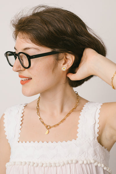Sabs Katz in a daisy enamel earring and an Expression Collection necklace from RIVA New York