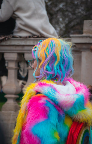 woman in rainbow hoodie with rainbow hair