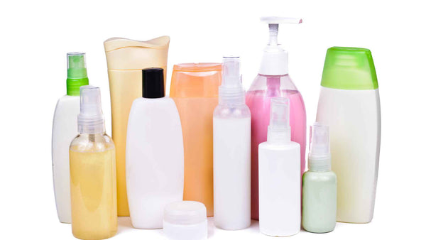 A group of different types of shampoos and conditioners designed to relieve scalp itch on a white background.