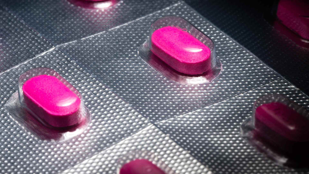 A pack of pink antihistamine pills.