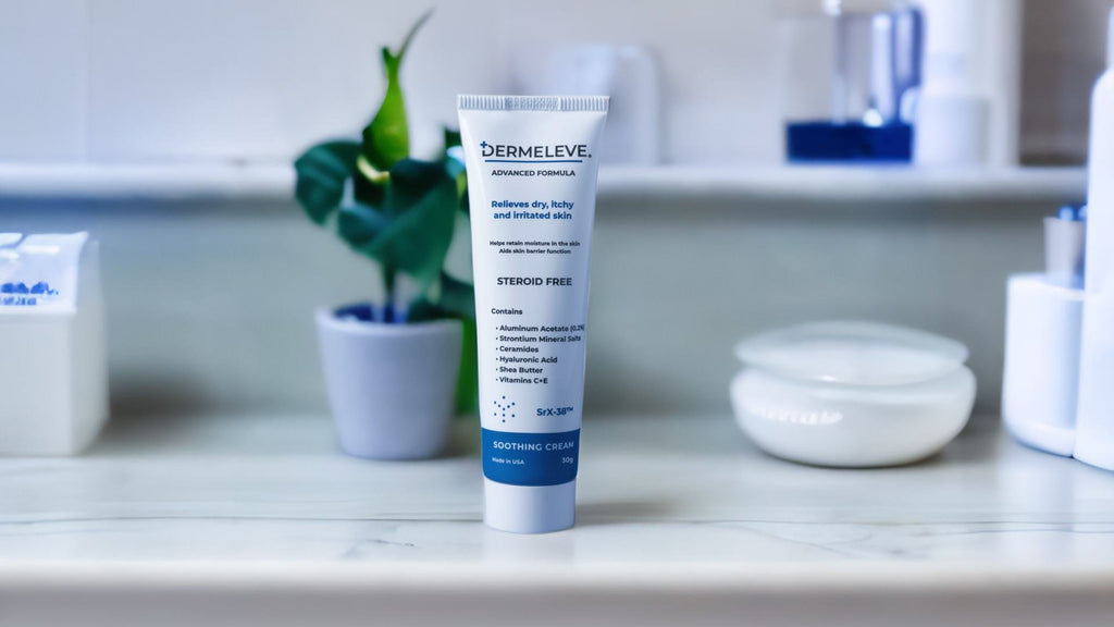 Tube of Dermeleve cream on a bathroom counter with other skincare products and a small potted plant in the background.