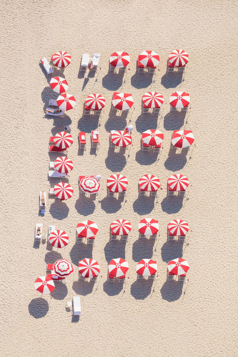 Red And White Striped Beach Umbrellas | Gray Malin