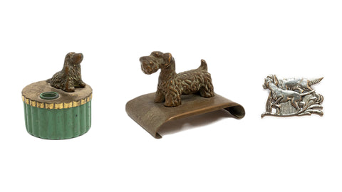 dog lovers desk items and jewellery by McClelland Barclay: spaniel pencil sharpener, scottie ink blotter and retriever sterling silver brooch, all from the 1930s