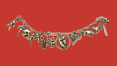 Very rare sterling silver 'courtship' charm bracelet by McClelland Barclay made in 1938 by Rice-Weiner & Co.