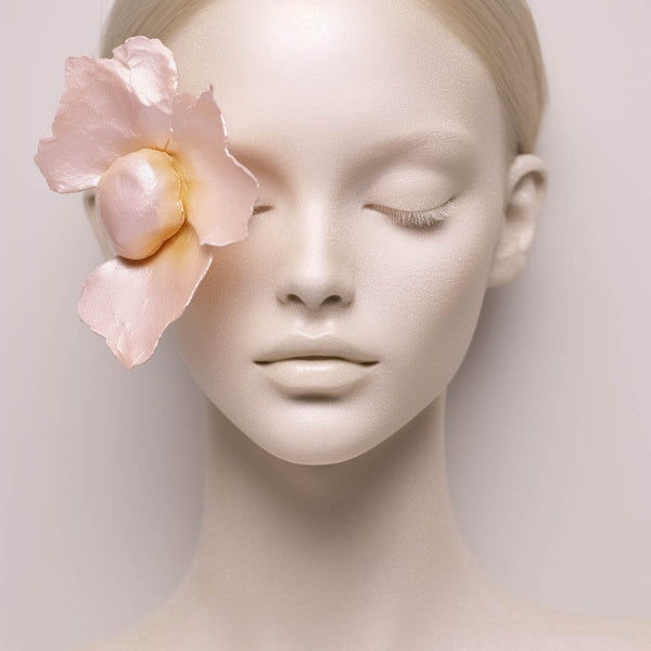 Ai created art - a NatureVerse of surreal ceramic flower in light pink and orange colours at a female face with light powder.