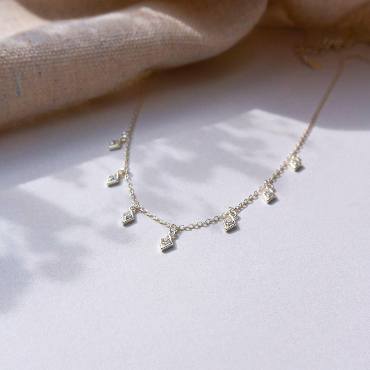 Multi Diamond Shaped Droplet Crystal necklace in silver and gold