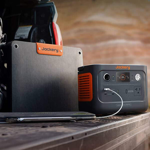 Jackery Explorer 300 Plus Portable Power Station Showing A Laptop Charging On Potable Power Station On The Trunk Of Truck
