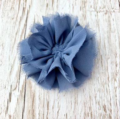 Blue ribbons together but slightly teased away to resemble gathered flower petals clearer