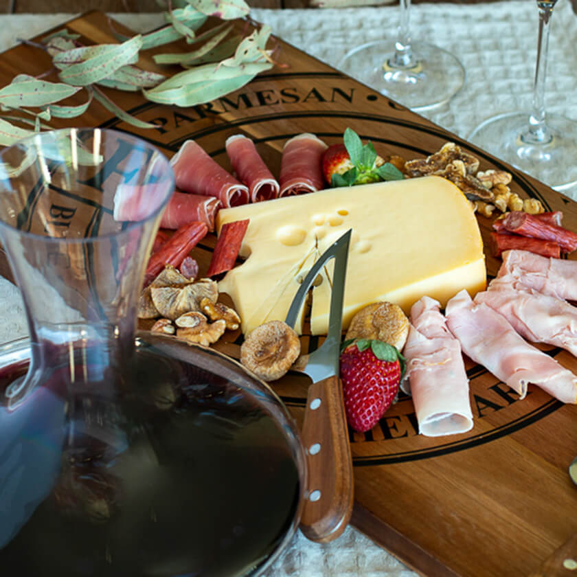 Wine served in Salut Decanter. Cheese, fruit and meat served on Fromage Cheese Board