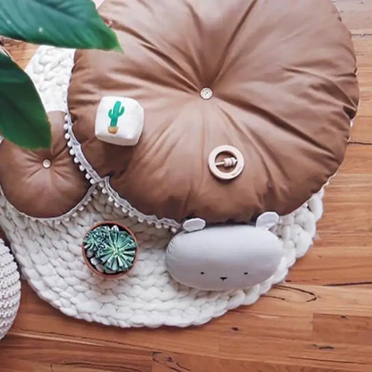 https://cdn.shopify.com/s/files/1/0594/8057/2096/products/MINSO-baby-round-floor-cushion-brown-baby-lounger.webp?v=1670897890&width=533