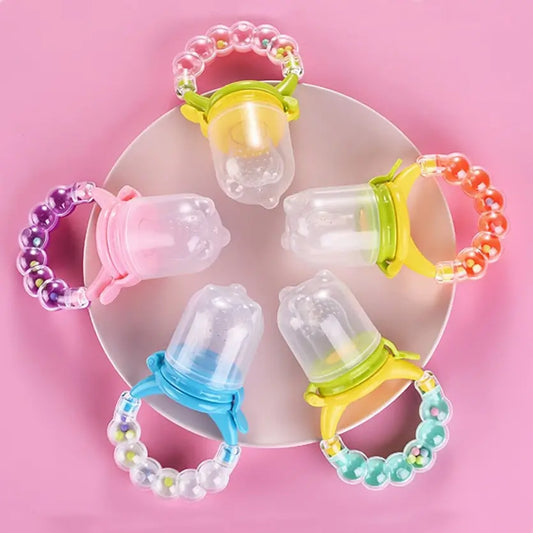 https://cdn.shopify.com/s/files/1/0594/8057/2096/products/baby-feeding-pacifier-teether-rattle-toy.webp?v=1662595437&width=533